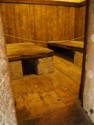 Wooden beds in a prison cell
